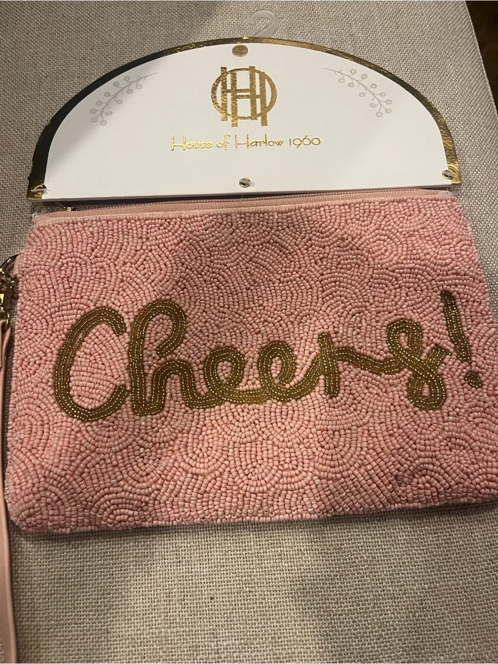 NWT House of Harlow 1960 Pink Beaded 'Cheers!' Wristlet Clutch with Gold Script